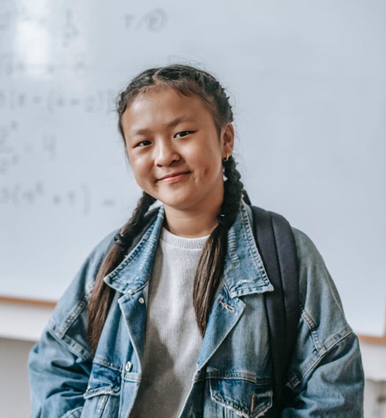 High school student posing in classroom